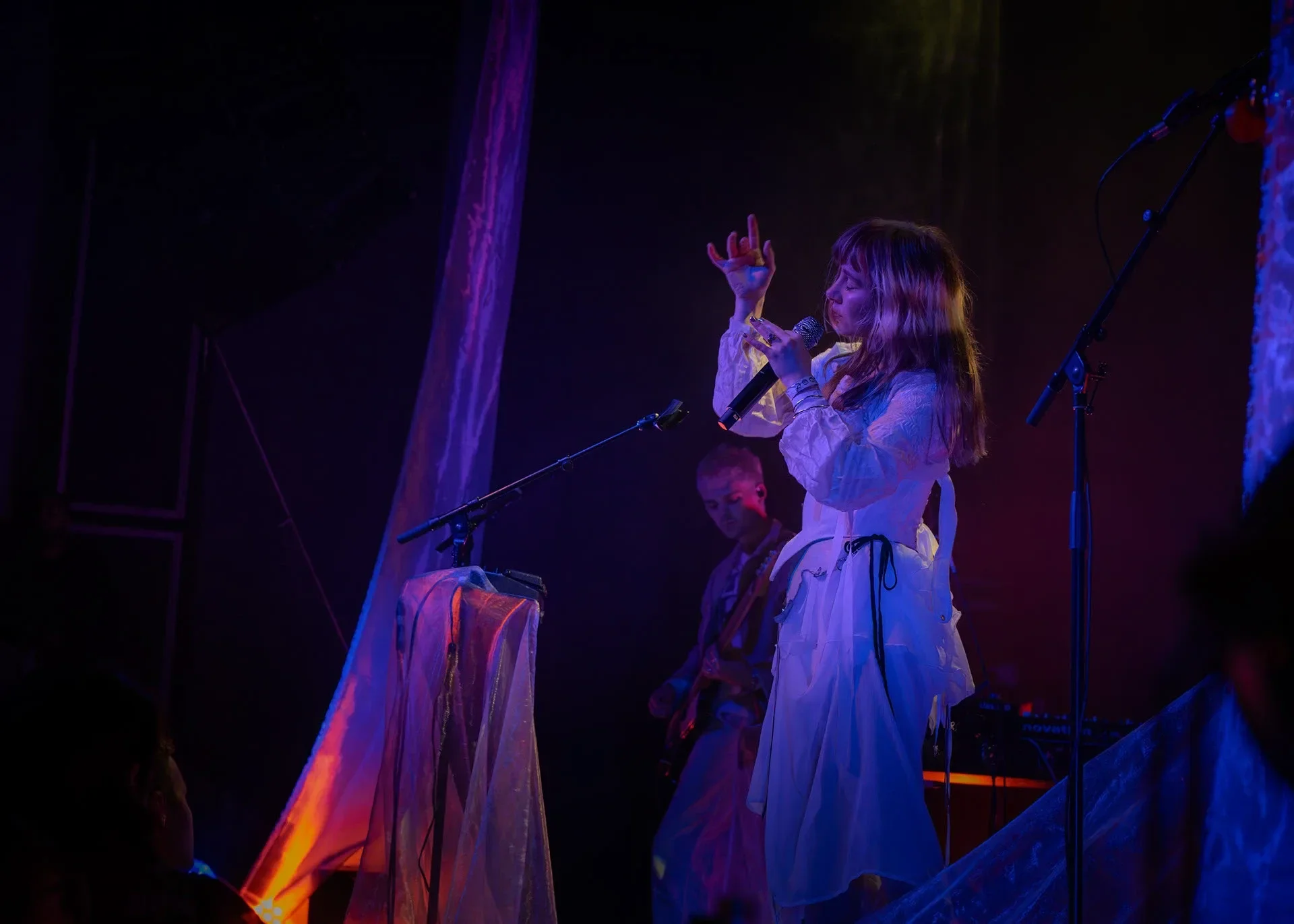 The Night Tapes bathed in stage lighting at The Pearl